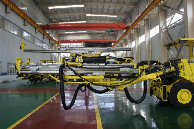 twin-boom face drilling rigs assembled in the factory, highlighting the heavy-duty hydraulic booms and feeds